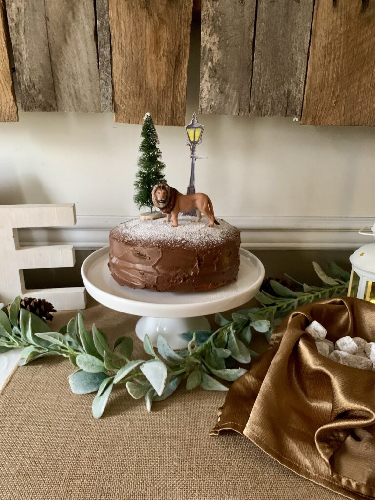 Aslan lamppost tree chocolate cake with powdered sugar snow for birthday