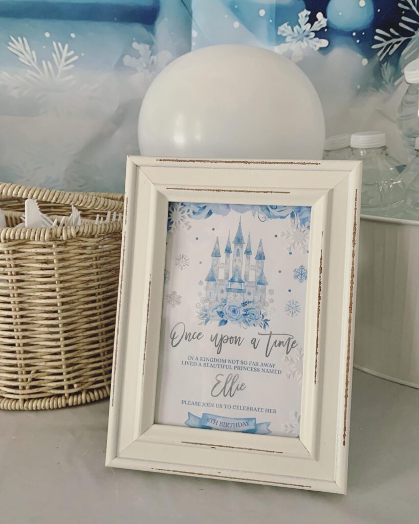 winter princess party invitation with blue castle snowflakes