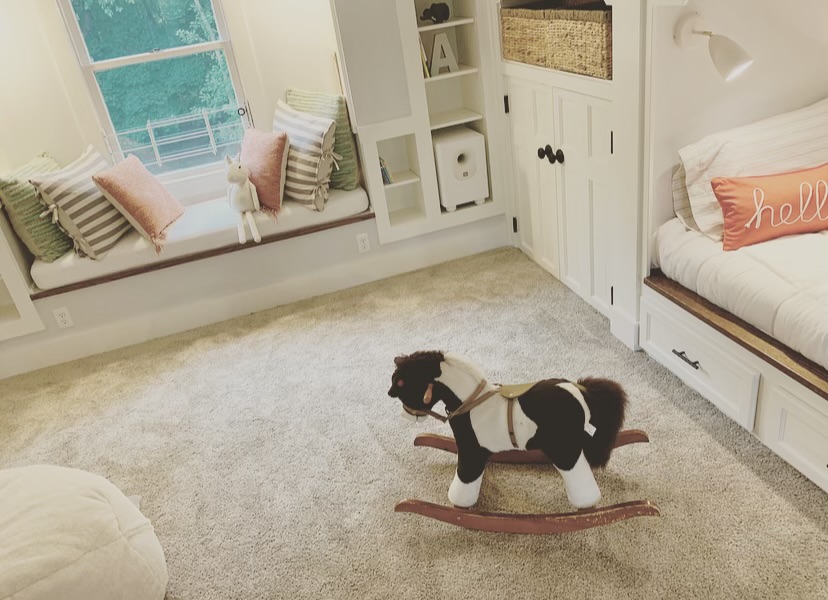 Rocking horse in attic renovation with built-ins