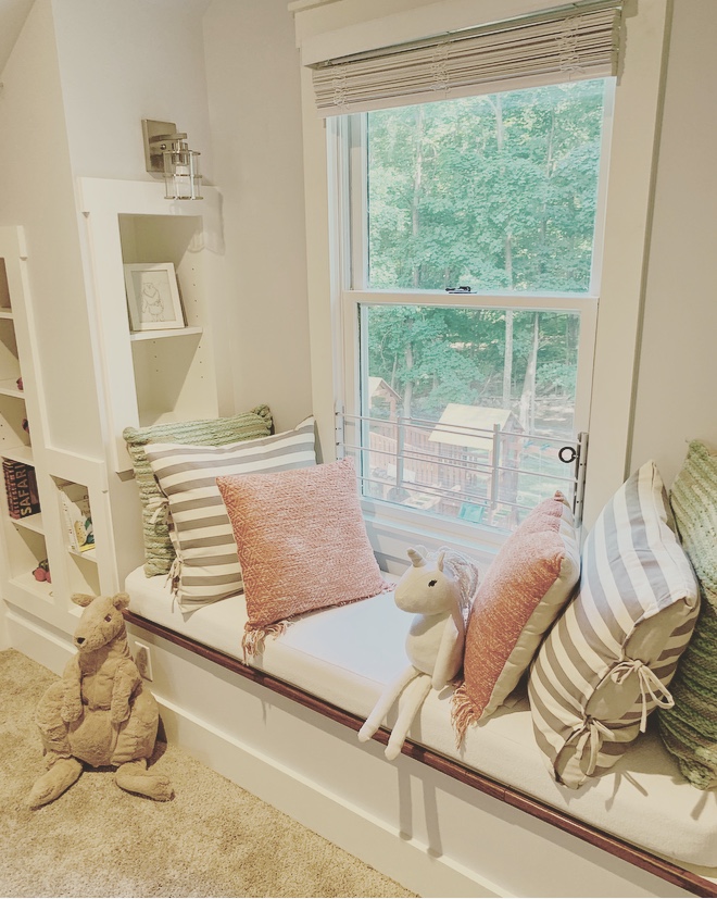 Attic window seat with decorative pillows