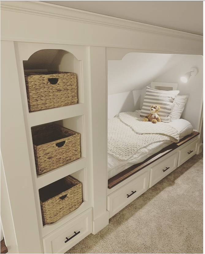 Attic built-ins with storage baskets, built-in bed