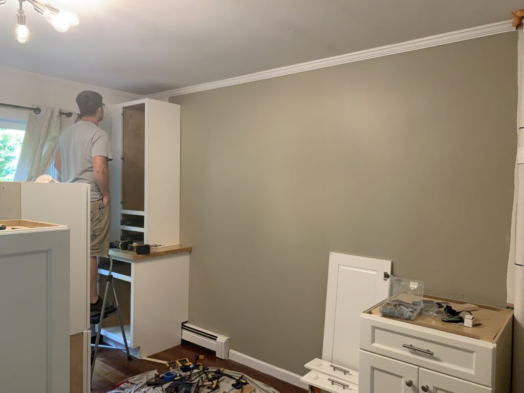 Builder Installing custom cabinets for homeschool room renovation