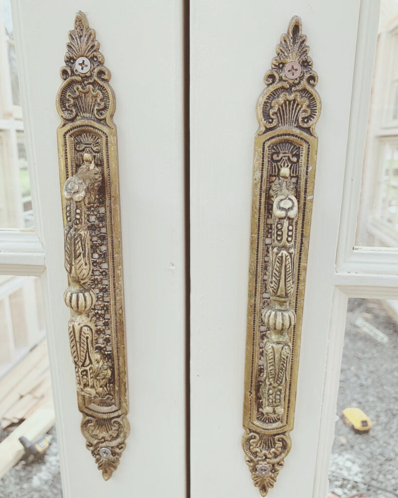 vintage door handles on greenhouse