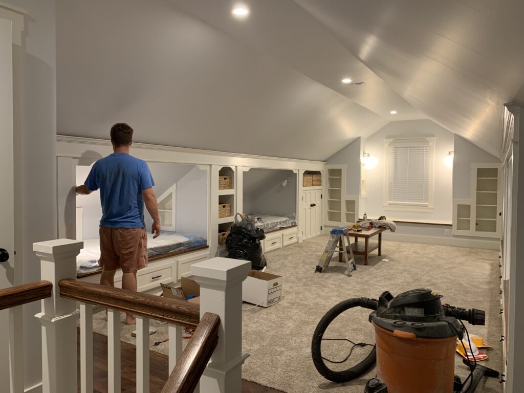 Attic renovation built-in beds and shelving