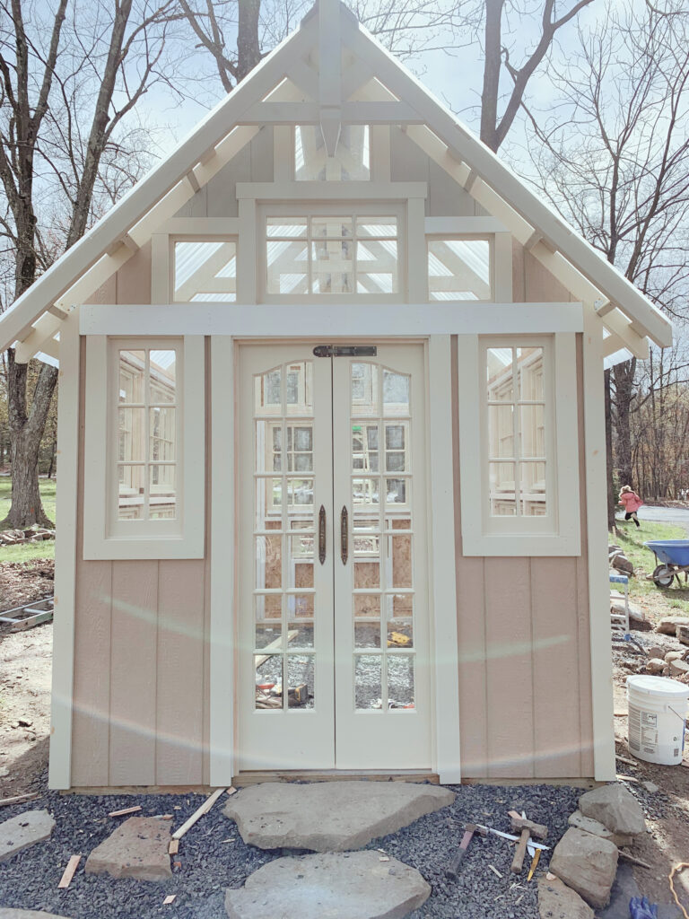 front entrance of greenhouse with big stones in front