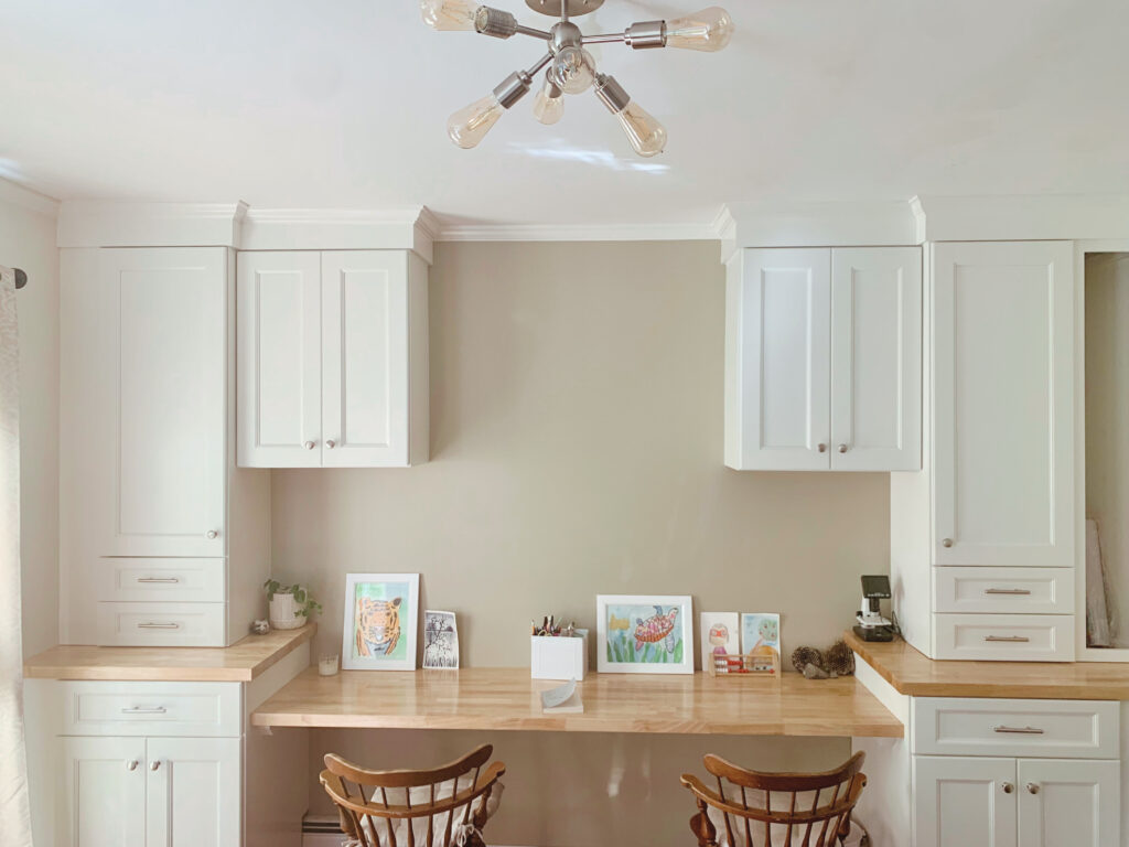 White homeschool room built-in desks, cabinets