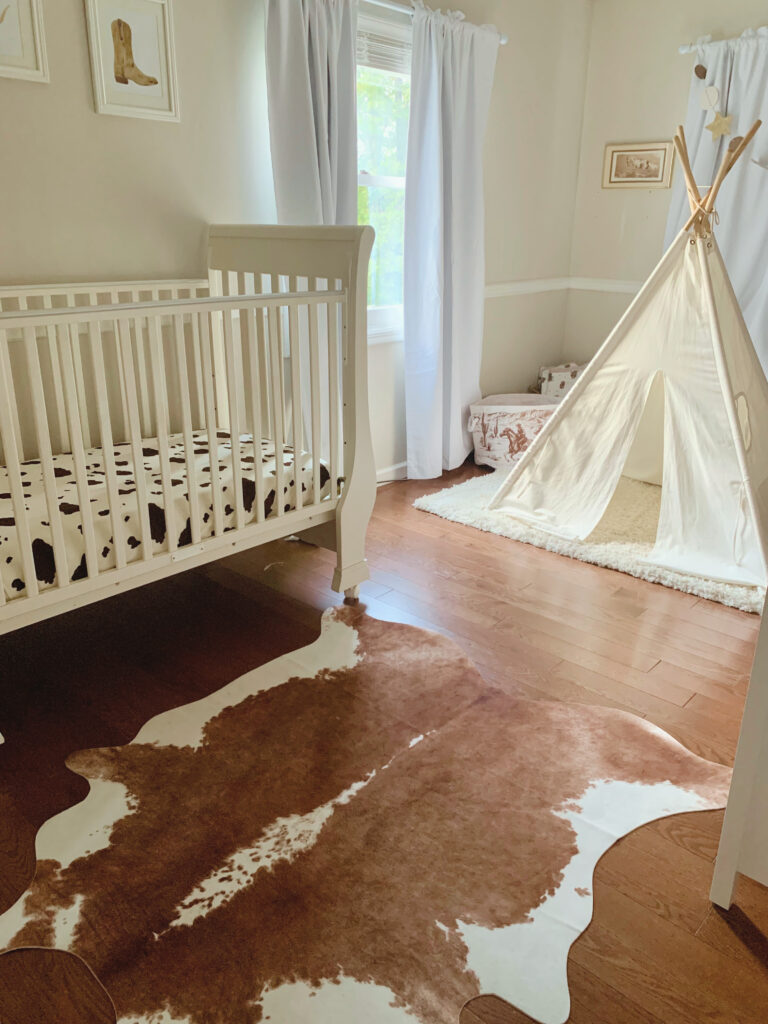 Western baby boy nursery crib with tent and horse related decor