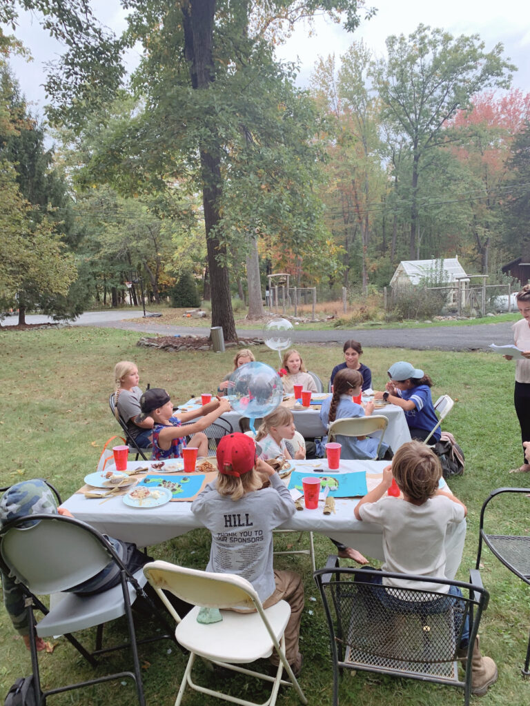 Outdoor book discussion for Twenty One Balloons