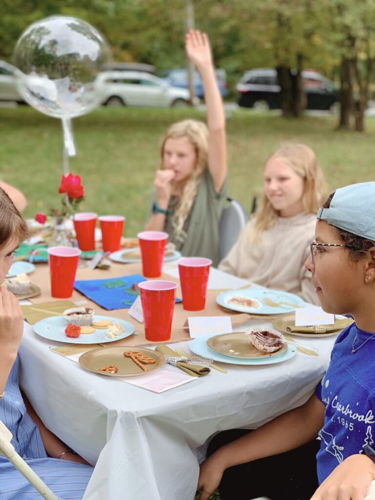 Kids eating at book discussion for Twenty One Balloons book