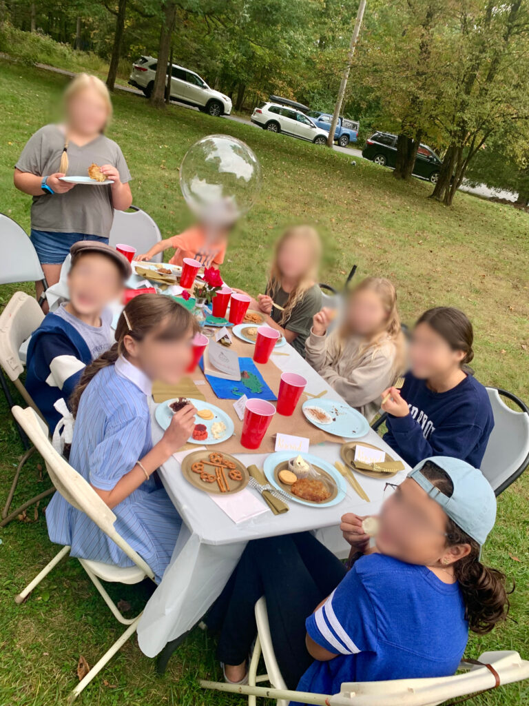 Kids at outdoor book discussion for twenty one balloons book