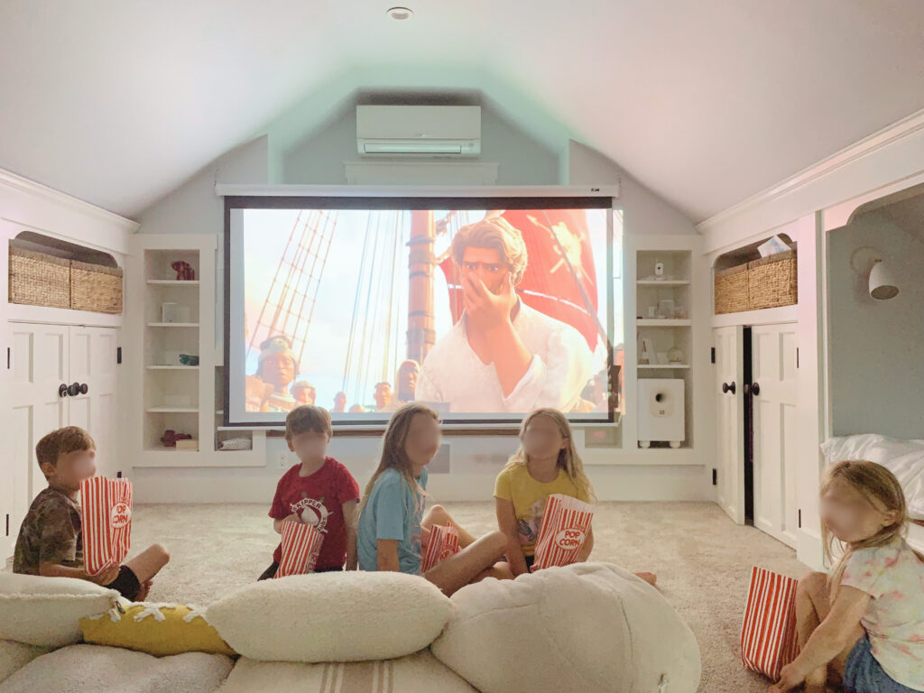 Attic renovation home theatre movie night kids with popcorn 