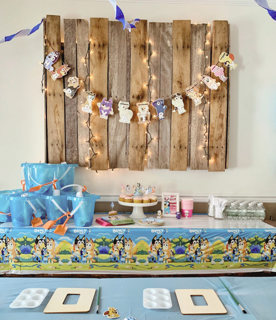 Bluey party decor with dessert and craft table