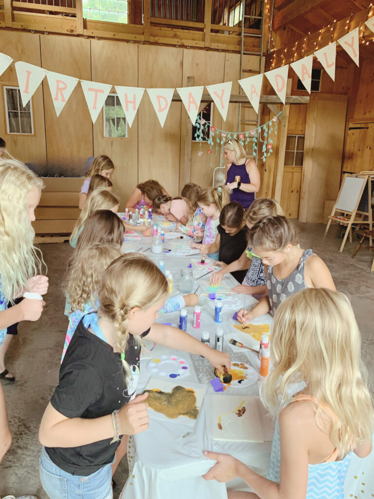 Panda party craft table setup in post and beam barn