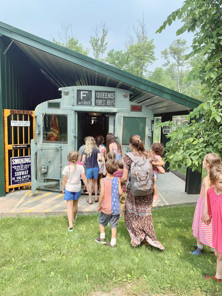 Kids touring subway train car 