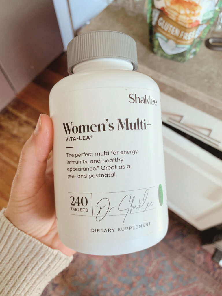 picture of women's vitamin bottle in kitchen