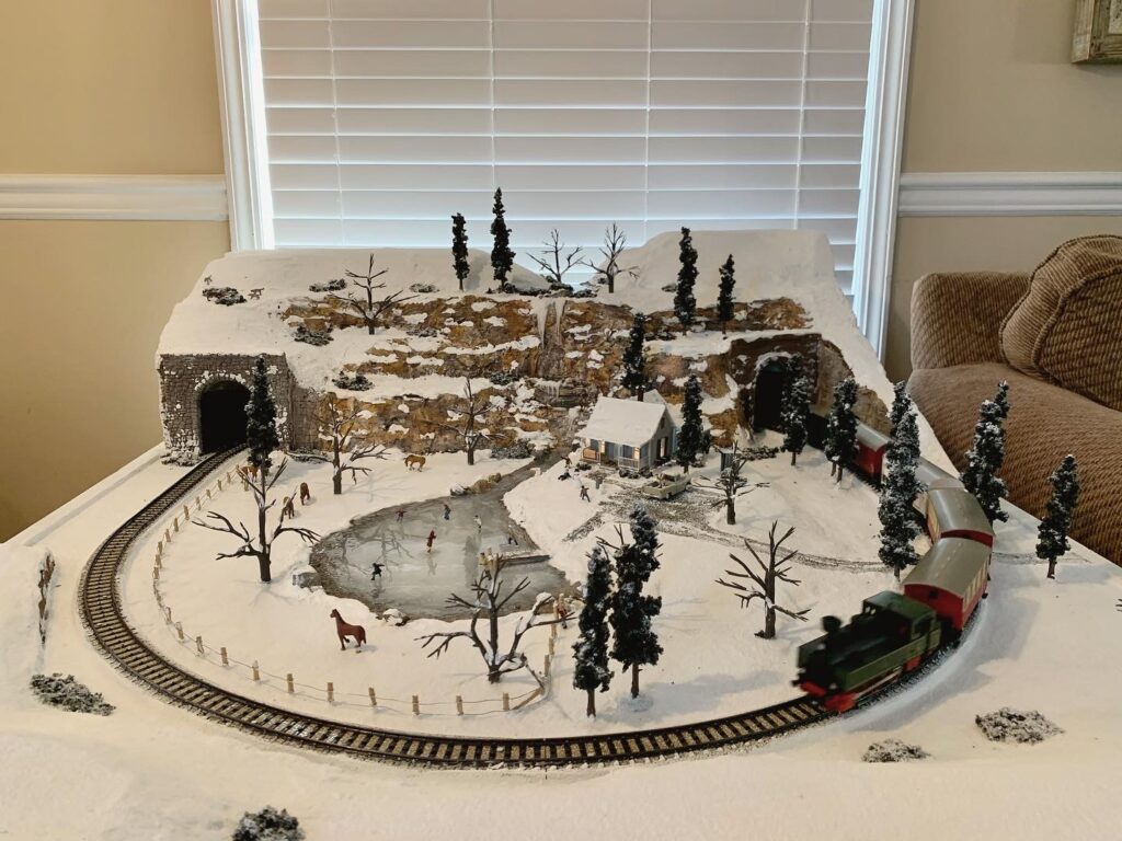 home made model train and village winter scene