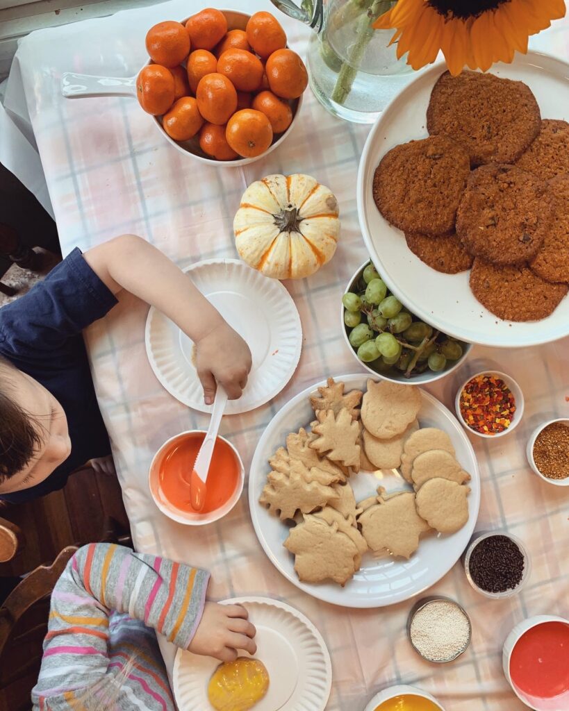 fall fool-proof sugar cookies on table with sprinkles and icing little kids surrounding