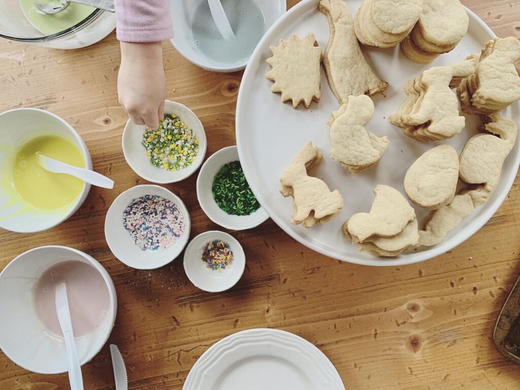 spring themed sugar cookies with icing and sprinkles kid decorating