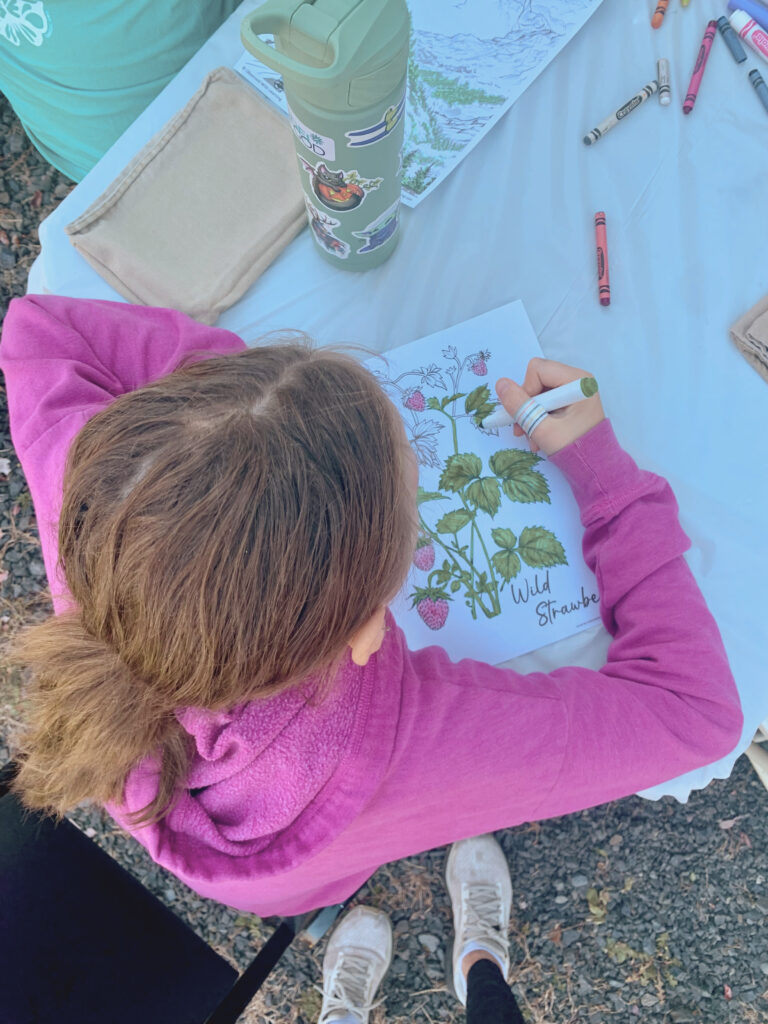 Girl coloring page with wild strawberries