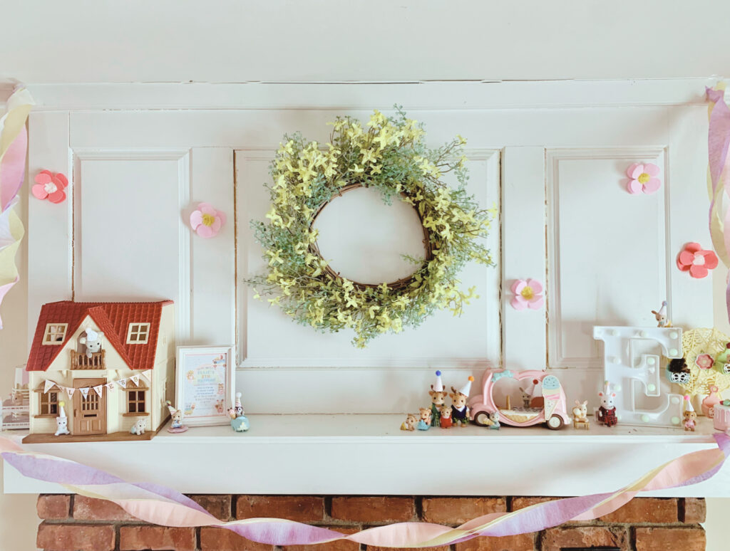 calico critter birthday party decorated mantel with critters in party hats, sylvanian families