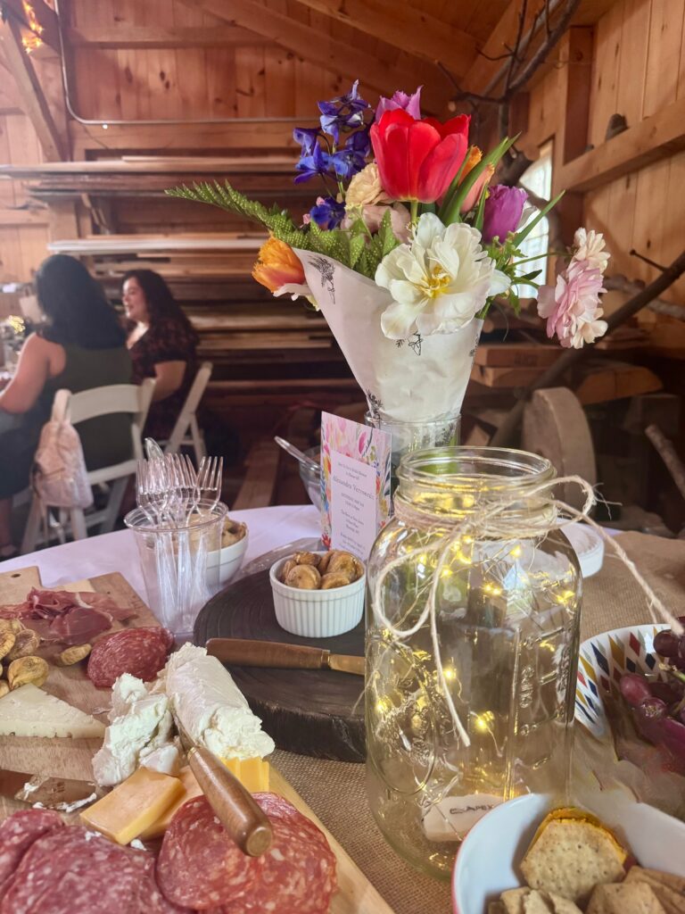 bridal shower in barn charcuterie with florals